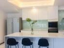 Modern kitchen with island and bar stools