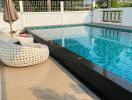 Outdoor pool area with seating