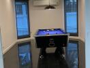 Indoor recreational room with a pool table and modern lighting