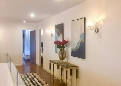 Modern hallway with artwork and console table