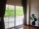 spacious living room with large windows and a view