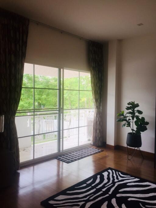 spacious living room with large windows and a view