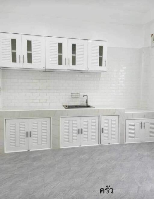 Modern white kitchen with cabinets and a sink