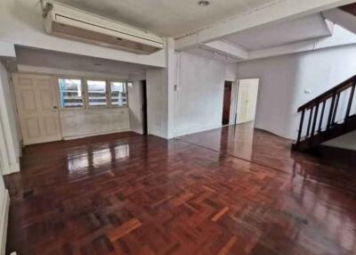 Spacious living room with wooden flooring and air conditioning