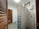 Bathroom with shower and wooden door