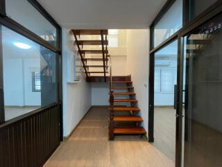 staircase with glass and wood interior