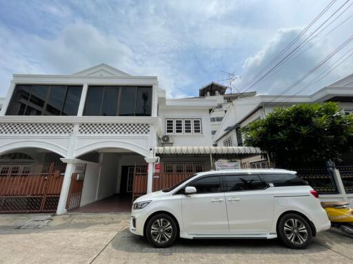 Front view of a building with a car parked outside