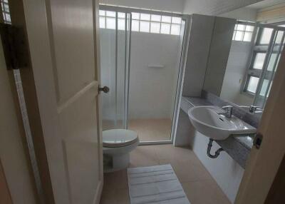 Modern bathroom with a shower and a single sink