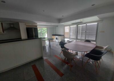 Modern kitchen and dining area with ample natural light