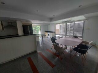 Modern kitchen and dining area with ample natural light