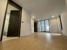 Spacious living room with wooden flooring and modern lighting