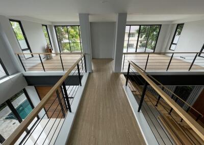 Modern open space with large windows and wooden flooring