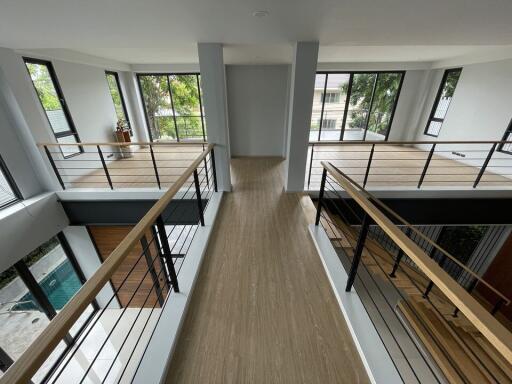 Modern open space with large windows and wooden flooring