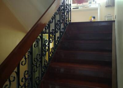 Photo of a staircase with ornate railing