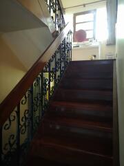 Photo of a staircase with ornate railing