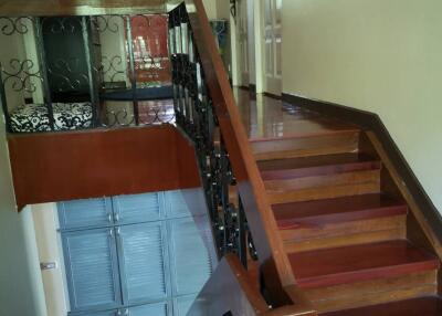 Wooden staircase with decorative railing in a residential home