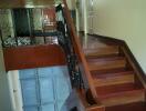 Wooden staircase with decorative railing in a residential home