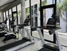 Modern gym facility with treadmills and large windows