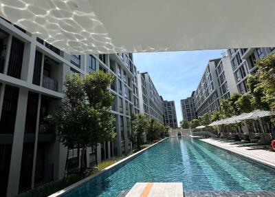 Modern apartment complex with outdoor swimming pool