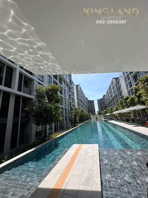 Modern apartment complex with outdoor swimming pool