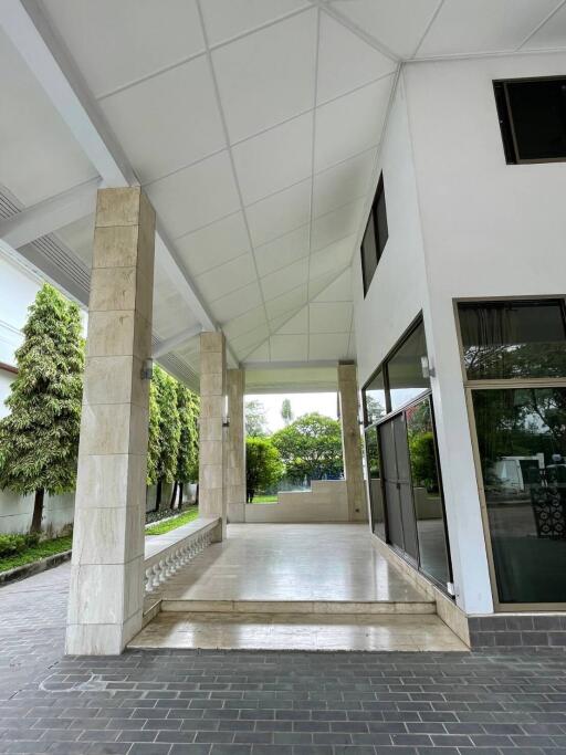 Main entrance with pillars and glass windows