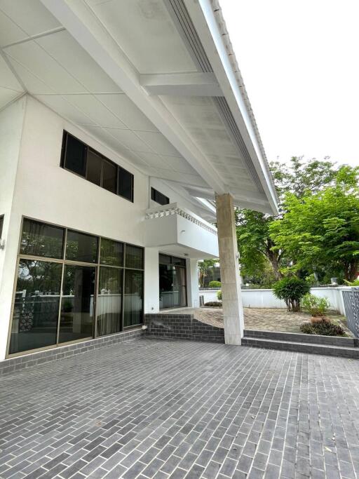 Exterior view of the building entrance with tiled pathway