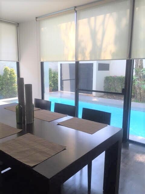 Dining area with a view of swimming pool