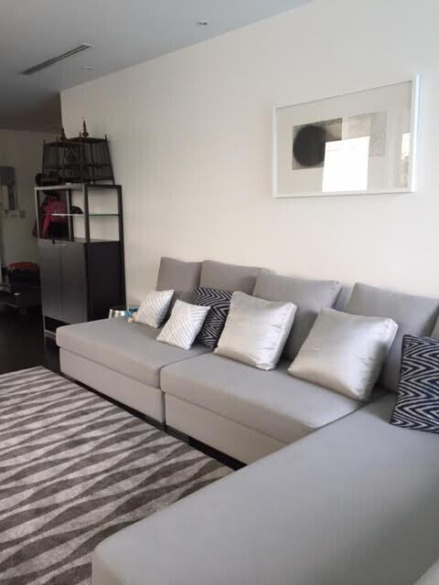 Modern living room with grey sofa and decorative pillows