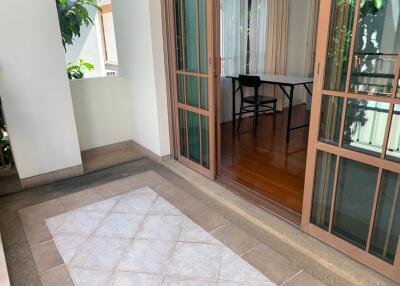 Balcony with sliding glass doors leading to an indoor area