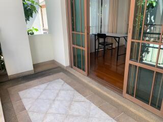 Balcony with sliding glass doors leading to an indoor area