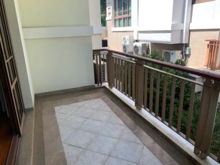 Spacious balcony with tiled flooring and railing