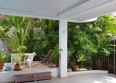 covered outdoor patio with garden