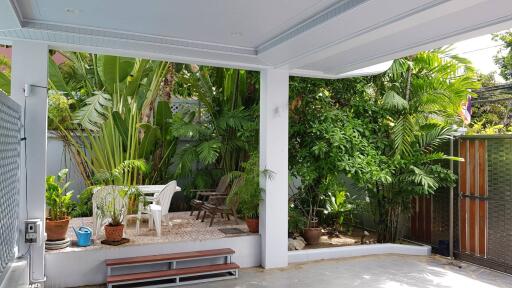 covered outdoor patio with garden