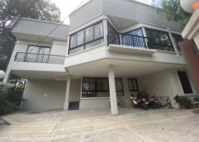 Front view of a modern residential building with garage