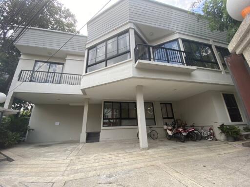 Front view of a modern residential building with garage