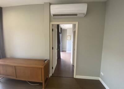 Room with air conditioner and wooden cabinet