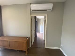 Room with air conditioner and wooden cabinet