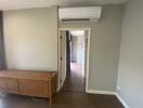 Room with air conditioner and wooden cabinet