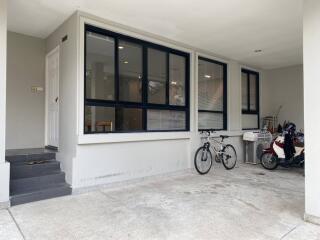 Garage area with bicycles and motorbike