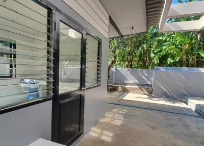 Enclosed outdoor area with modern windows