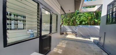 Enclosed outdoor area with modern windows