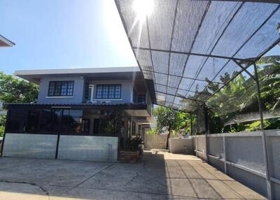 Front view of a modern house with a carport