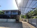 Front view of a modern house with a carport