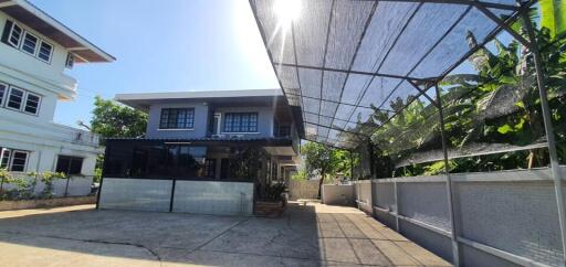 Front view of a modern house with a carport