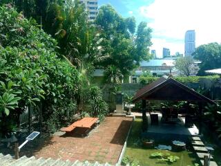 A well-maintained garden with a gazebo and pond