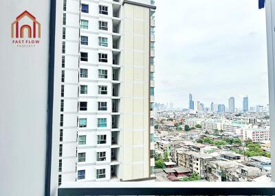 View from a balcony with a cityscape and nearby buildings