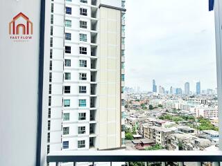 View from a balcony with a cityscape and nearby buildings