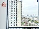 View from a balcony with a cityscape and nearby buildings