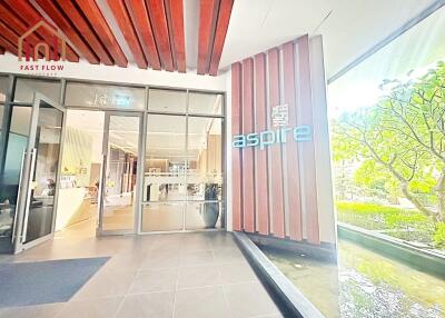 Entrance of Aspire building with signage and glass doors