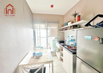 Modern kitchen with dining area and balcony